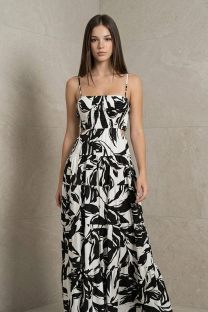 Black and white floral printed woven cut out maxi dress with adjustable straps and tiered skirt