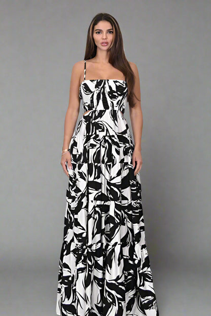 Amanda Maxi Dress worn by a model, showcasing the Floral Printed Woven Cut Out Maxi Dress design with bold black and white floral print.
